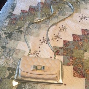 Adorable gold toned cross body