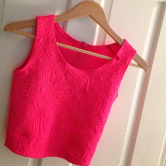 Hot pink crop top w/ a pattern on it
