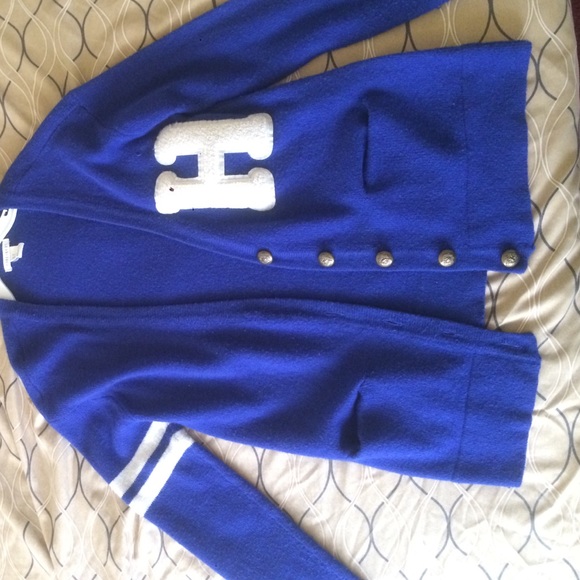 Blue cardigan with H on side