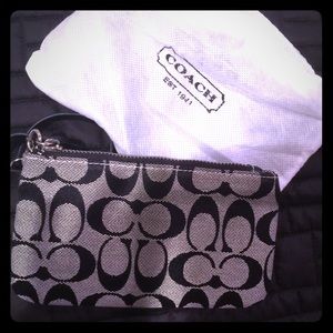 Coach black "c" print wristlet. Never used.