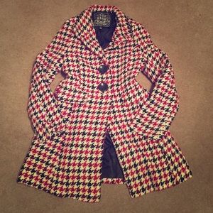 Red and black houndstooth coat