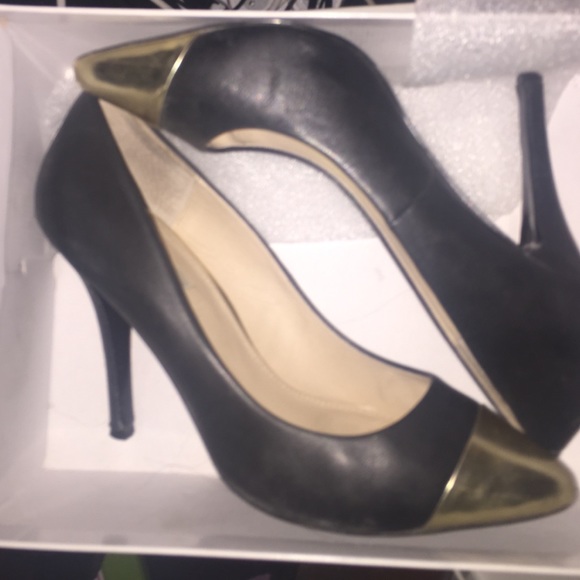 Black and gold pumps