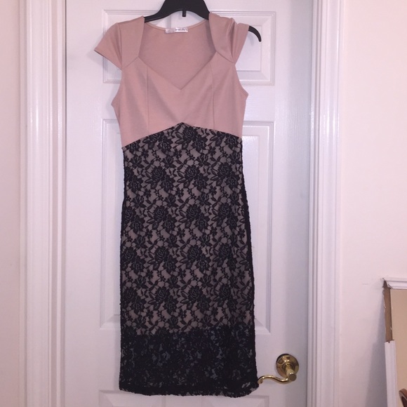 Tan, body hugging dress with black lace overlay