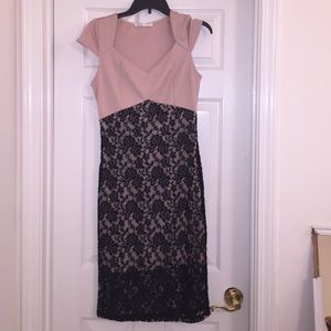 Tan, body hugging dress with black lace overlay