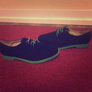 Black and green loafers