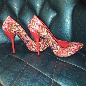 Red pointed toe pumps.