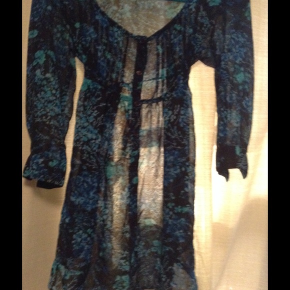 Gently worn sheer blouse with tie in back
