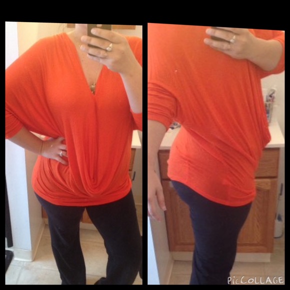 Jennifer Lopez flowing orange top