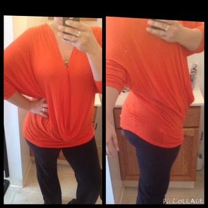 Jennifer Lopez flowing orange top