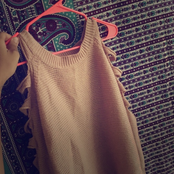 Sweater with shoulder cut outs.