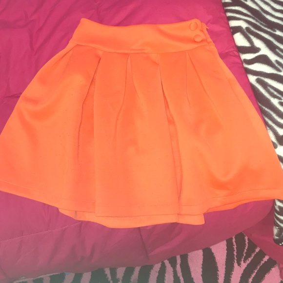 Orange pleated skirt
