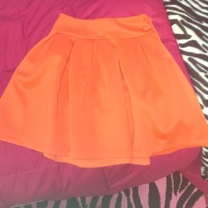 Orange pleated skirt