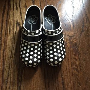 Black and white polka dot clogs