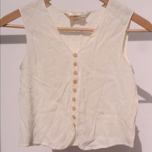 Cream sleeveless blouse