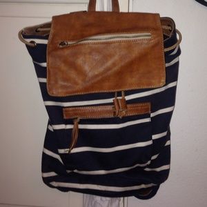 Navy and cream striped backpack with leather