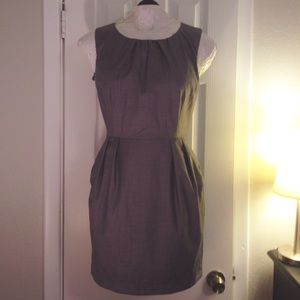 Gray sleeveless dress w pleated neckline & pockets