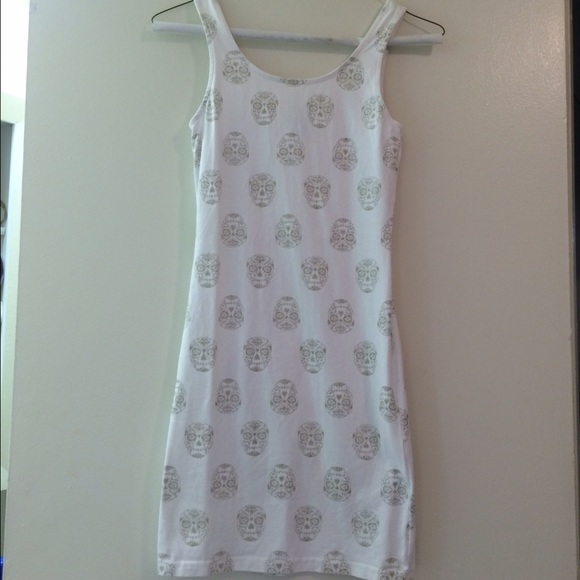 Bodycon dress with gold skulls. NWOT
