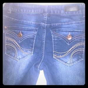 Skinny jeans with embellished flap back pockets