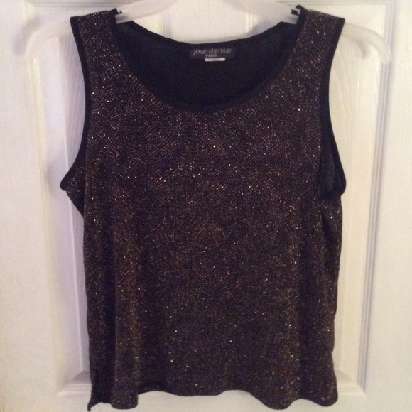 Sleeveless black top with gold threads in it.