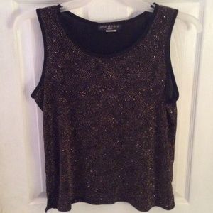 Sleeveless black top with gold threads in it.