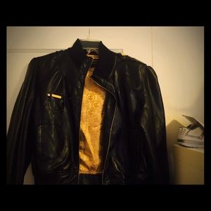 Size XL Rocawear black patent leather jacket.