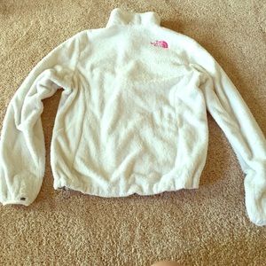 White North Face jacket with pink writing