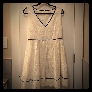 Anthro white flower dress with black piping sz M