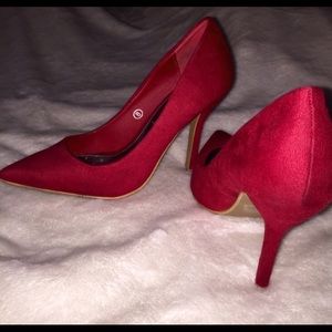 Pointy red heels