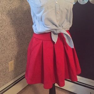Red pleated skirt