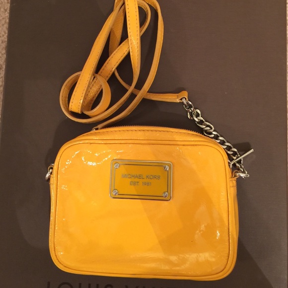 Mustard colored MICHEAL KORES cross body purse