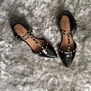 Black studded flats