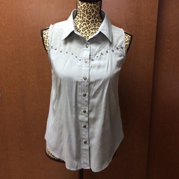 mine - teal shirt, metal buttons.
