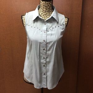 mine - teal shirt, metal buttons.