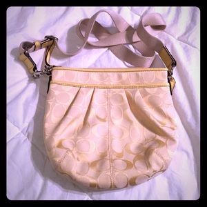 Light yellow Coach purse.