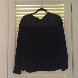 Long sleeve black blouse. Vegan leather upper.