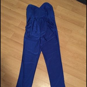 Blue jumpsuit with pockets still has tags on