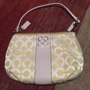 Small pale yellow coach bag