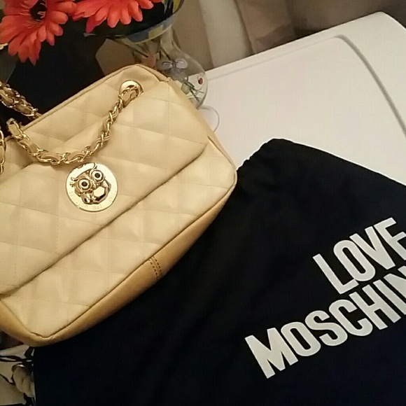 Authentic Moschino purse with gold chain handles
