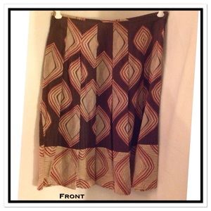 Pleated flowing fabric skirt earthy colors