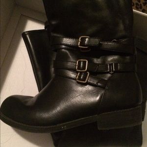Black tall boots worn twice