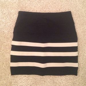High-waisted, black and tan-striped skirt.