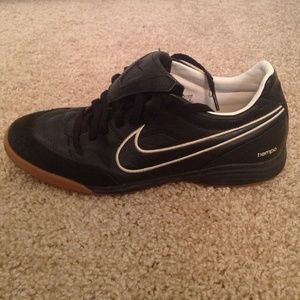 Black nike Tiempo indoor soccer shoes.