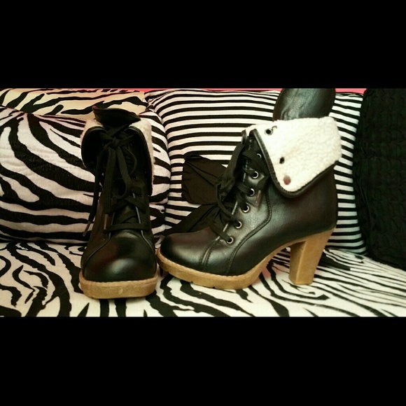 Black and brown combat heels.