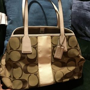 Tan multi section coach purse