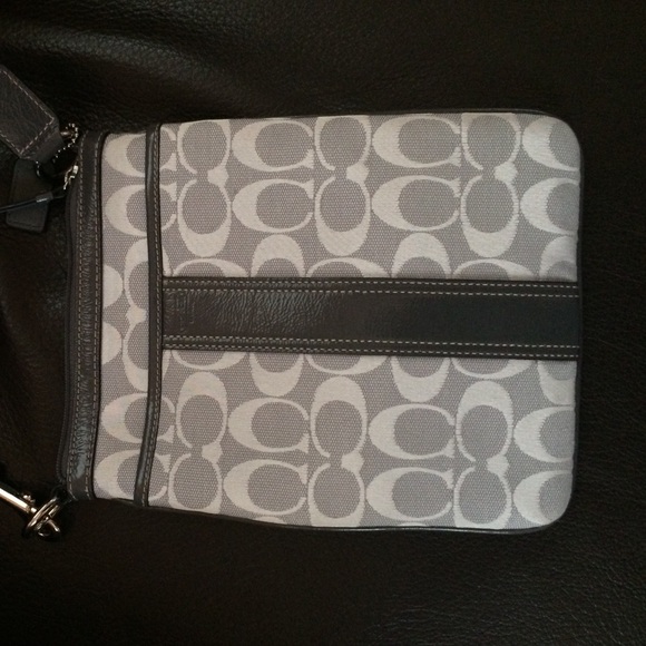 Gray and white Coach cross body bag