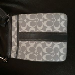 Gray and white Coach cross body bag