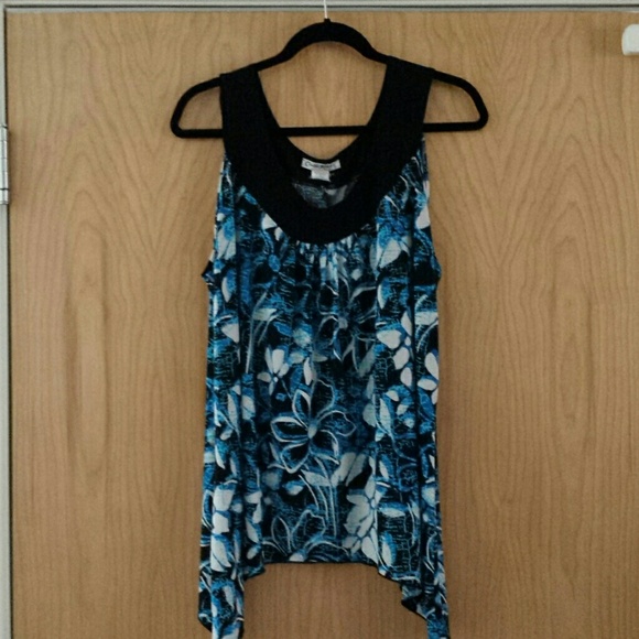 Blue top with flowers.