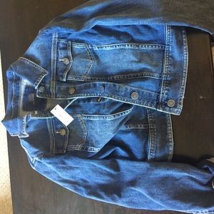 The limited size large jean jacket with tags.