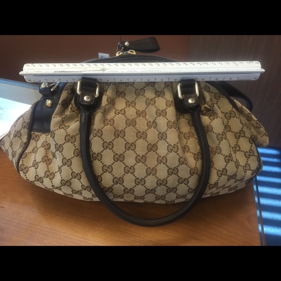 Gucci Purse normal wear and tear.