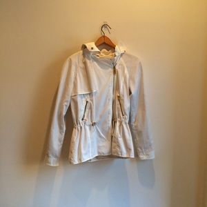 White windbreaker with gold details